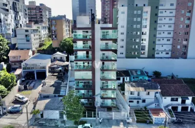 Apartamento semimobiliado de dois dormitórios sendo um suíte.