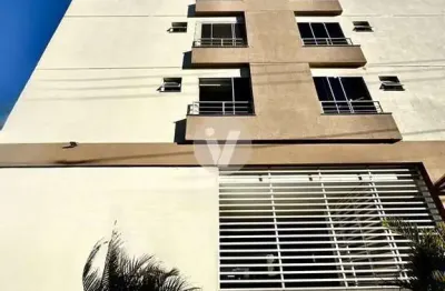 Apartamento à venda 2 dormitórios semimobiliado com vaga para dois carros.