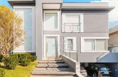 Oportunidade única: vende-se luxuosa residência mobiliada com 5 suítes e vista deslumbrante!