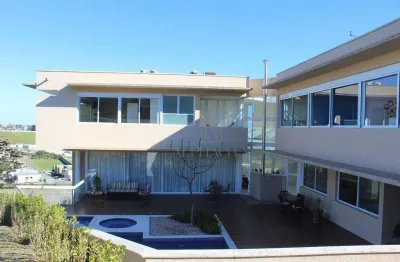 Elegante sobrado com 4 suítes e área de lazer privativa - design moderno e integrado