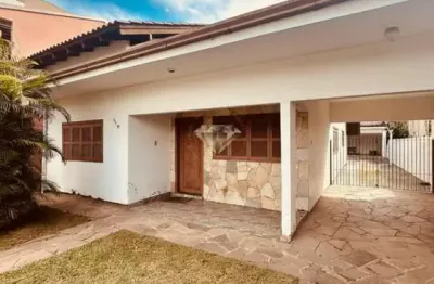 Casa à venda em sapucaia do sul, centro, com sala de estar, jardim e área construída de 193.4m²