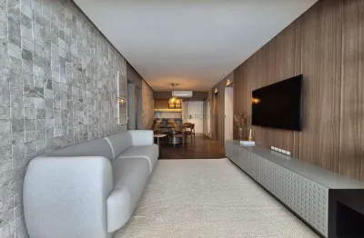 Apartamento mobiliado com sacada integrada e vista parcial do mar