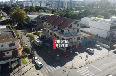 Prédio comercial com 7 lojas e 13 salas comerciais a venda no bairro camaquã - av21756
