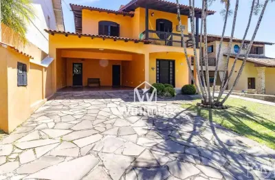 Casa com 4 dormitórios à venda, 210 m² por R$ 850.000,00 - Condomínio Cantegril - Viamão/RS