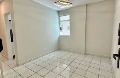 Prédio frente mar apartamento lateral 1 dormitório semimobiliado com elevador