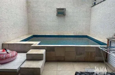 Sobrado com 3 dormitórios à venda, 140 m² por R$ 950.000,00 -  Guilhermina - Praia Grande/SP