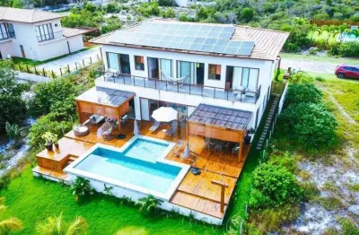 Casa a venda em praia do forte, litoral norte da bahia - condomínio praia bella, acesso direto à praia, 5 suítes de alto padrão porteira fechada.