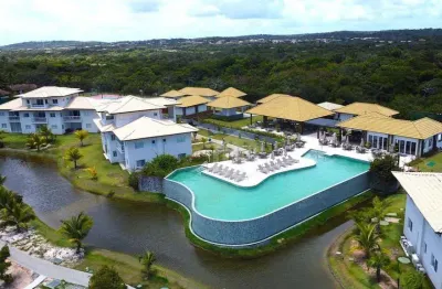 Apartamento à venda no village das ipês – praia do forte, bahia | 2 suítes | frente lago | 2 vagas cobertas!