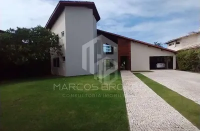 Linda casa com  6 suítes, sistema de energia solar, 400,00 m² de área construída, em condomínio com lazer.