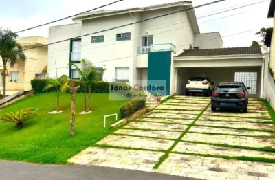 Casa a venda no condomínio aruã lagos ii em mogi das cruzes, com 300m² de construção em 2 lotes e um amplo quintal. por r$2.400.000,00