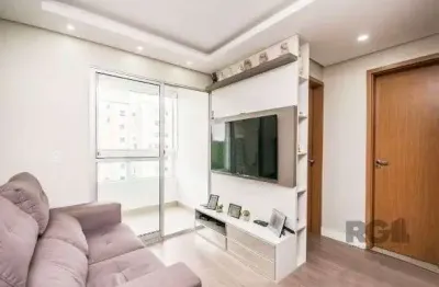 Apartamento com 2 quartos, sala, cozinha, sacada com churrasqueira e 1 vaga.