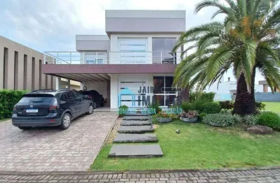 Sobrado com 4 suítes à venda, por r$ 2.160.000 - condomínio marítimo - tramandaí/rs