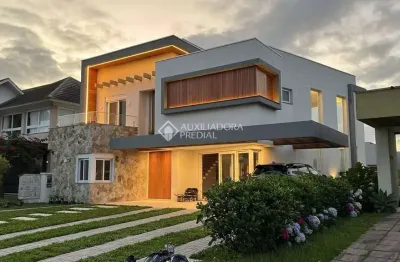 Casa em condomínio fechado com 4 quartos à venda na honório germano, 195, condomínio dubai resort, capão da canoa, 247 m2 por r$ 2.490.000