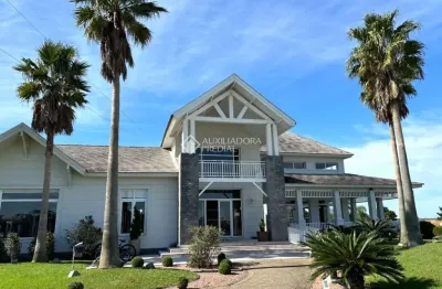 Casa em condomínio fechado com 5 quartos à venda na rs-030 km 095, 7463, cruzeiro do sul, tramandaí, 290 m2 por r$ 3.160.000