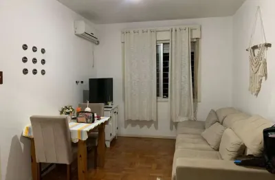 Apartamento de 2 dormitórios, living, cozinha, área de serviço e banheiro social