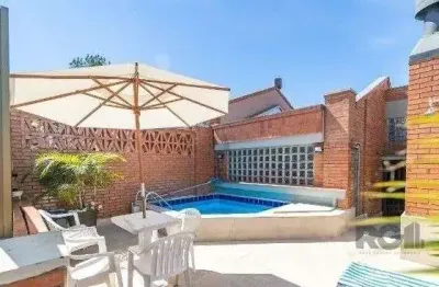 Casa em condomínio fechado com 3 quartos à venda na Avenida Jacuí, 978, Cristal, Porto Alegre