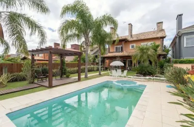 Casa em condomínio 4 dormitórios à venda belém novo porto alegre/rs
