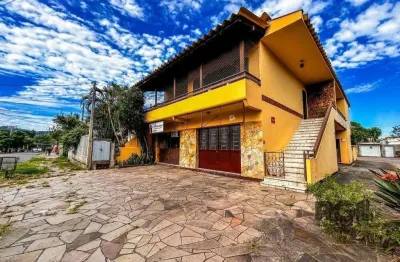 Casa com 2 salas comerciais, 3 quartos, vaga de garagem churrasqueira, suíte, no