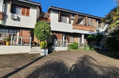 Casa em condomínio fechado com 3 quartos à venda na Avenida da Cavalhada, 6021, Cavalhada, Porto Alegre