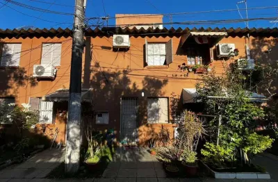 Casa em condomínio fechado com 3 quartos à venda na Rua Mura, 356, Guarujá, Porto Alegre