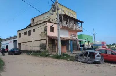 Prédio comercial e residencial, composta por 03 lojas, 03 apartamentos e 01 galpão com 150,00m², área total construída 450,00m², frente para rodovia