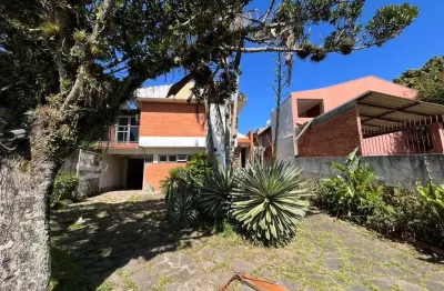 Casa com 3 quartos à venda na Rua Jacundá, 164, Guarujá, Porto Alegre
