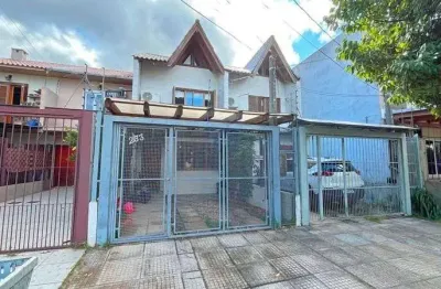 Casa com 2 quartos à venda na Rua Itacyr Rossi, 233, Guarujá, Porto Alegre
