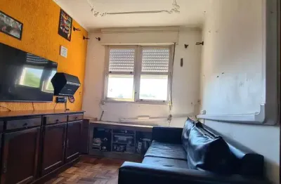 Apartamento de 2 dormitorios e vaga de garagem rotativa em Porto Alegre.