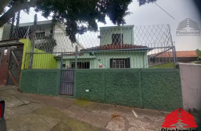 Casa térrea com edícula 90 metros área construída, sendo: casa frente 1 quarto, sala, cozinha 1 banheiro, corredor lateral, cozinha com gabinete e arm