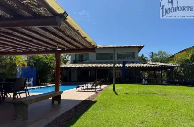 Linda casa 4 suítes, em condomínio frente mar bem próximo da vila !