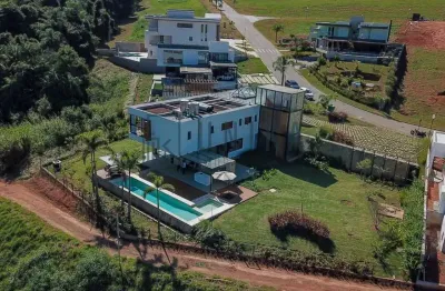 Luxuosa casa em condomínio à venda em itupeva-sp, bairro rio abaixo - 5 quartos, 3 suítes, 5 banheiros, 4 vagas, 620m². cond. serrazul