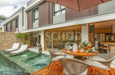 Casa de condomínio mobiliada com 3 suítes, sala de jogos e cinema, à venda no alto da boa vista