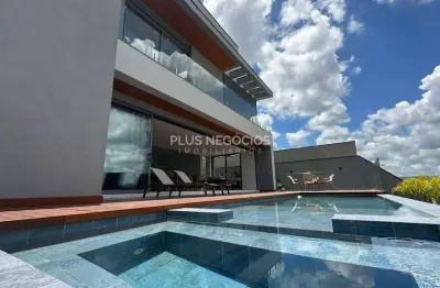 Casa nova no Alphaville 2 com 5 suítes, piscina com borda infinita e vista incrível — estuda até 10