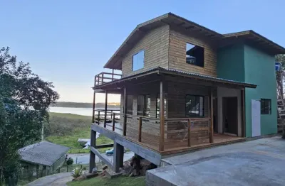 Casa com vista para lagoa na costa do macacu  próximo da cachoeira  garopaba sc
