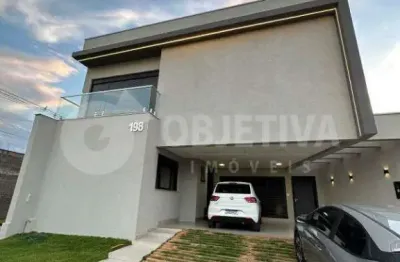 Excelente casa a venda em condomínio de alto padrão na zona leste no condomínio raros em uberlândia