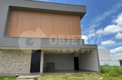 Belíssima casa nova de alto padrão localizada no condomínio tamboré uberlândia disponível para compra