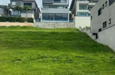 Terreno em condomínio fechado à venda na alameda das aroeiras, alphaville, santana de parnaíba por r$ 1.550.000