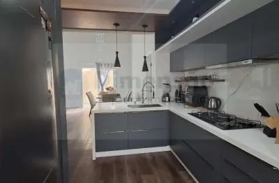 Casa moderna de alto padrão com três quartos e piscina na pedra branca