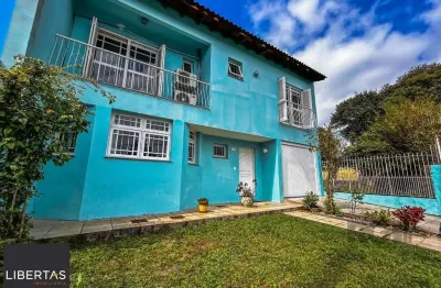 Casa com 4 quartos à venda na Rua Jerolomo Minuzo, 146, Vila Nova, Porto Alegre