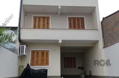 Casa 3 quartos, 4 vagas, salão de festa, sacada 198m² bairro Rubem Berta, Poa/RS