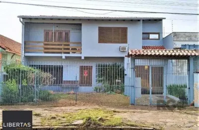 Casa com 3 quartos à venda na Rua Vítor Valpírio, 489, Anchieta, Porto Alegre