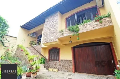 Casa com 3 quartos à venda na Rua Umbú, 137, Passo da Areia, Porto Alegre