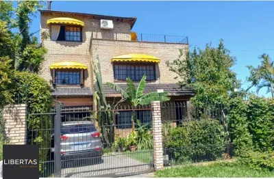 Casa com 4 quartos à venda na Rua Arapei, 325, Cristal, Porto Alegre