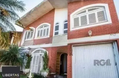 Casa sobrado no bairro Tristeza de 4 dormitórios 3 vagas para alugar