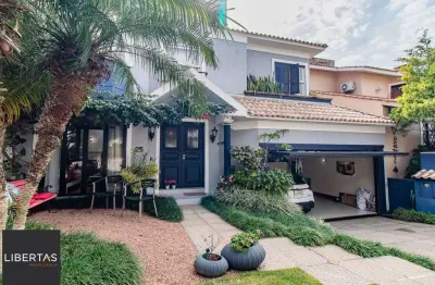 CASA DE 4 DORMITÓRIOS EM CONDOMÍNIO - 320 m² - 4 VAGAS DE GARAGEM