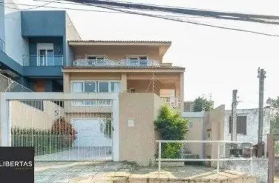 Casa com 3 quartos para alugar na Rua Joaquim Cruz, 521, Santo Antônio, Porto Alegre