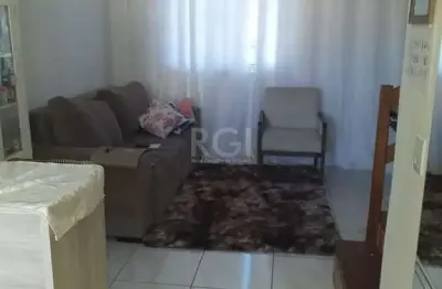 Casa com 2 quartos, banheiro, área de serviço, cozinha, vaga de garagem, no bairro Aberta dos Morros/RS