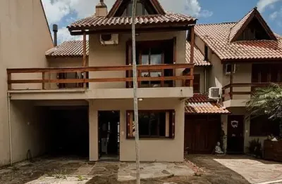Casa em condomínio fechado com 3 quartos à venda na Avenida Orleaes, 105, Guarujá, Porto Alegre