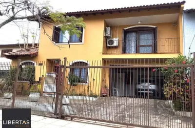 Casa com 5 quartos à venda na Rua André Primo Biazetto, 414, Campo Novo, Porto Alegre