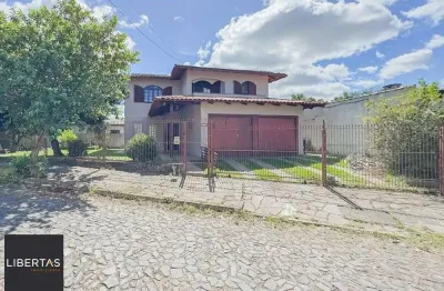 Casa com 5 quartos à venda na Rua Vicente Celestino, 430, Rubem Berta, Porto Alegre